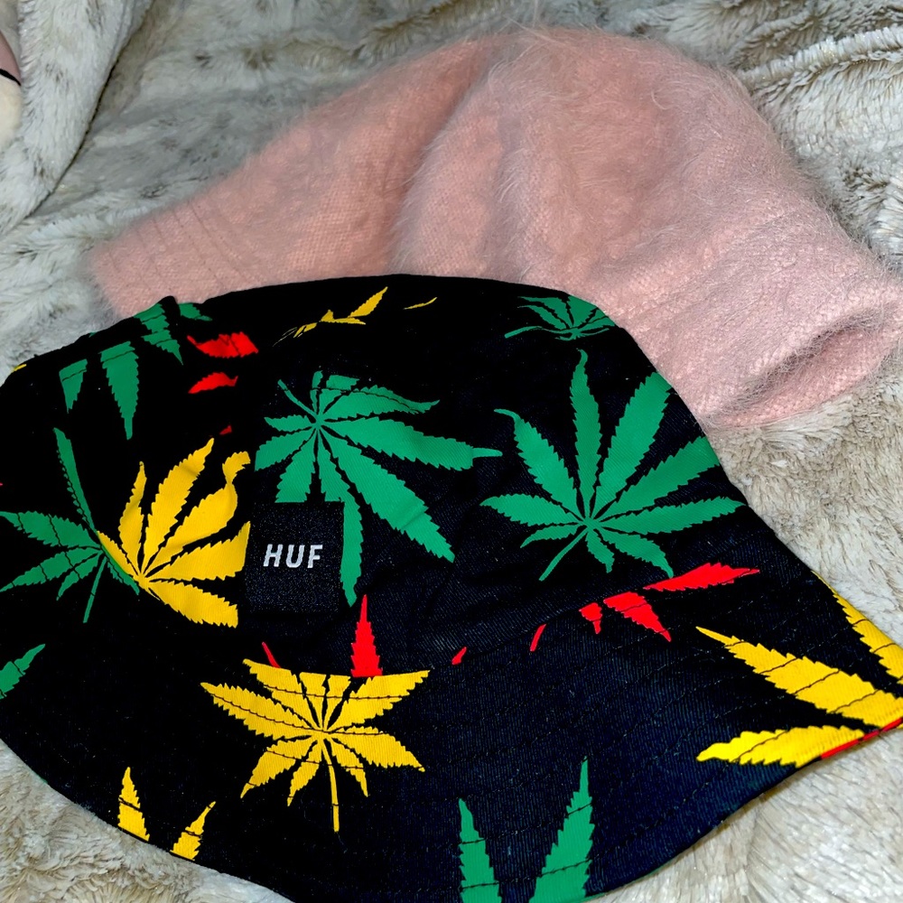 Two bucket hats 1) HUF with leaf design 2) pink fuzzy hat.